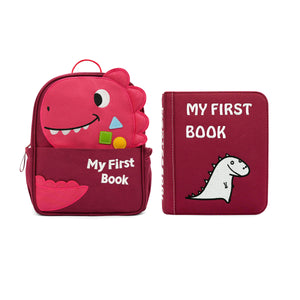 Pink dinosaur backpack and 'My First Book' on a white background