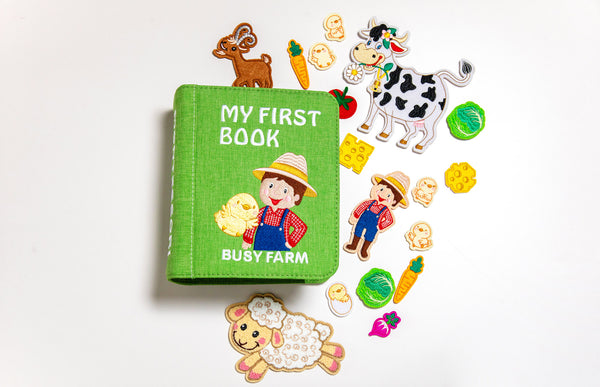 My First Book Busy Farm busy book product photo, showing several of the cute characters and pieces included for all the Montessori inspired activities. 