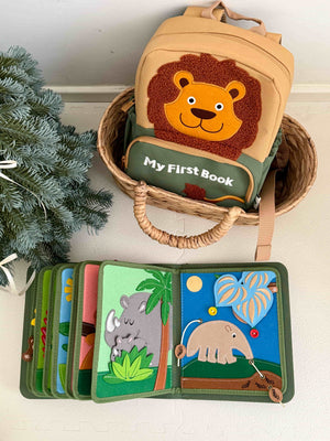 MyFirstBook fabric busy book backpack with lion face design and interactive activity pages displayed