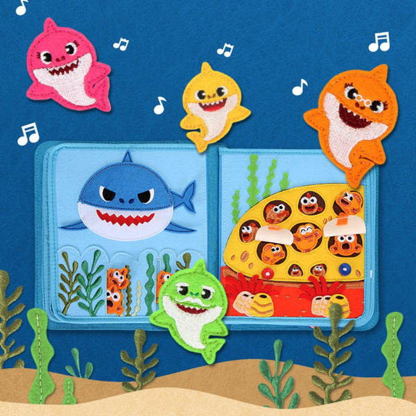 A page of My First Book Baby Shark busy book product photo, showing the cute characters and sensory interactive play in this Montessori inspired book. Makes a great baby gift.