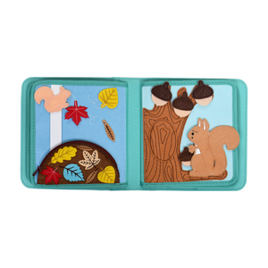 Product photo showing two pages of the My First Book Nordic Forest busy book, highlighting adorable animal characters and interactive sensory play in this Montessori-inspired design. A great baby gift.