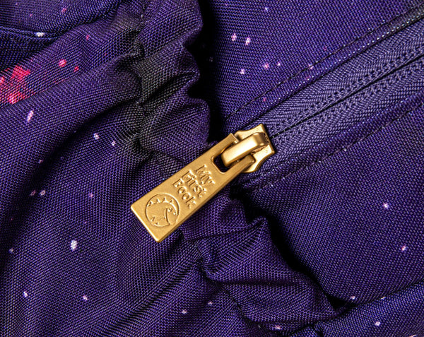 A close up, detailed photo of the high-quality, waterproof backpack zipper that is included with the My First Book Space Montessori book. Makes a great baby gift.